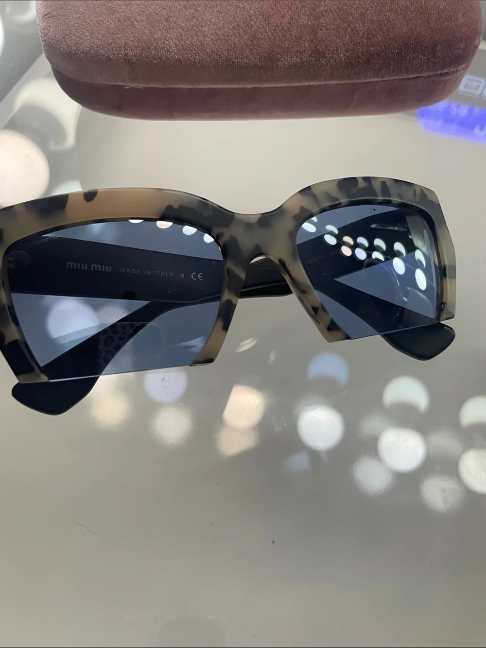 Miu Miu Tortoiseshell Cat-Eye Sunglasses with Dark Blue Lenses
